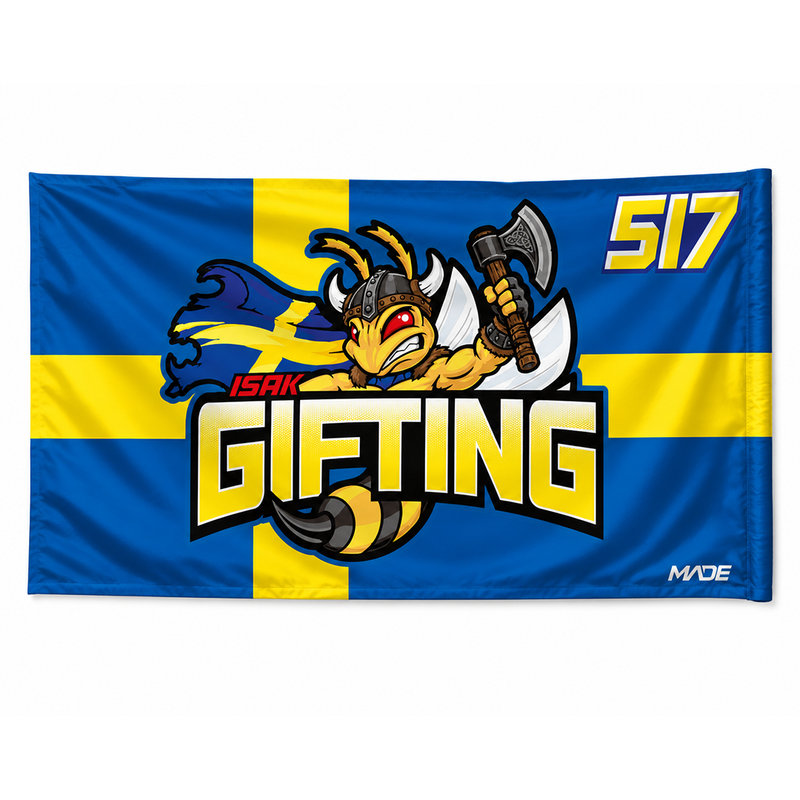 Flag with a cartoon character holding an axe, text 'ISAK GIFTING 517', and 'MADE' branding on a blue and yellow background.