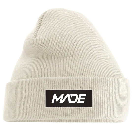 Beige beanie with 'MADE' logo on a black background - Madestickers.com Almond#color_almond