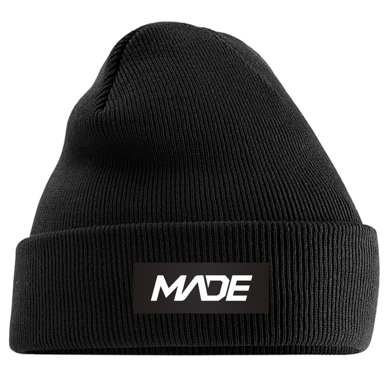 Black beanie with 'MADE' logo on a black background - Madestickers.com Black#color_black