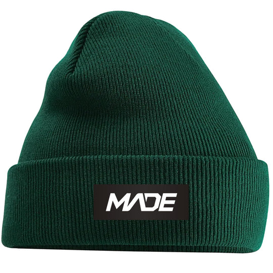 Green beanie with 'MADE' logo on a black background - Madestickers.com Green#color_green